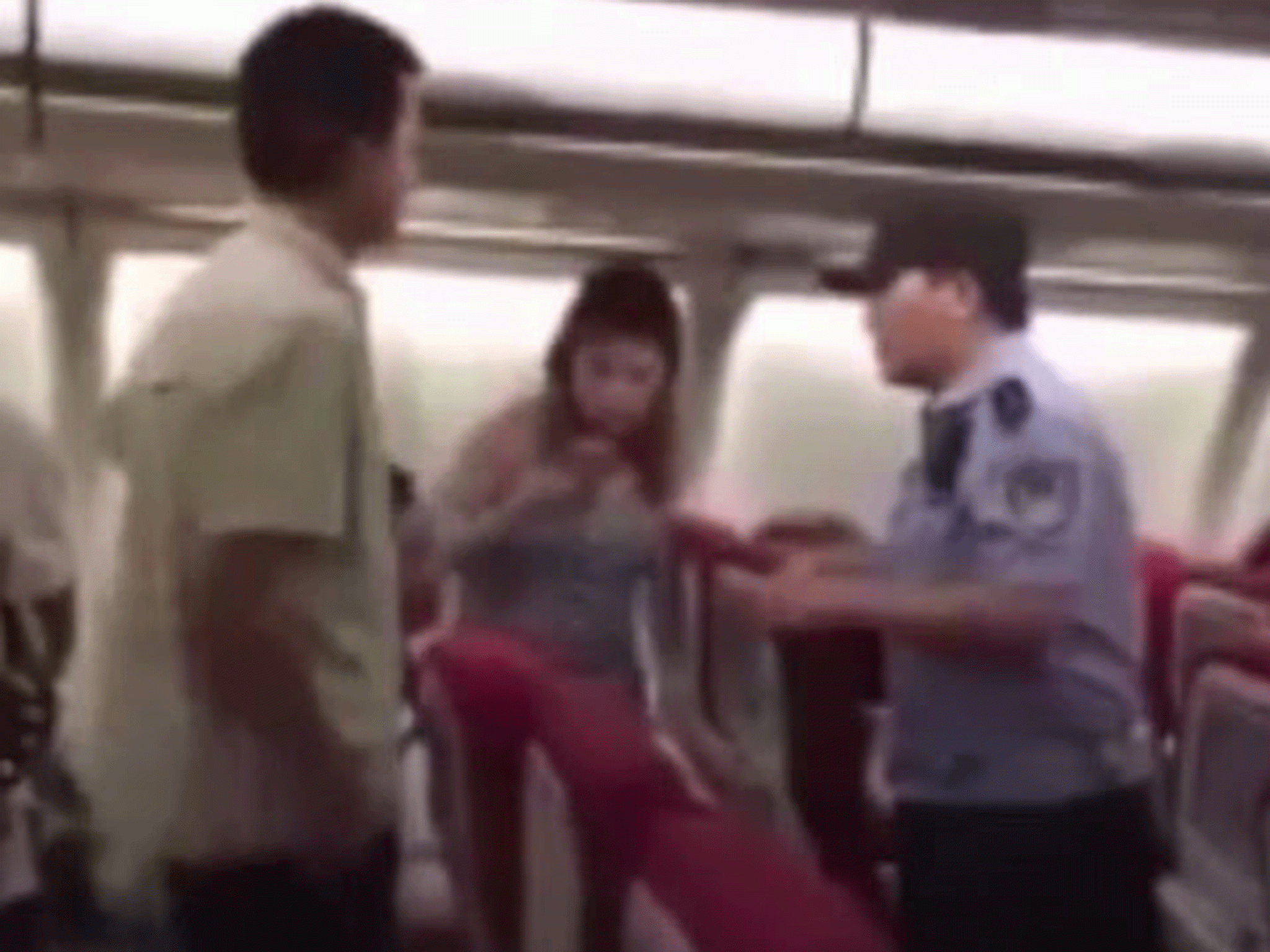 Police were called onto the flight after passengers ended up throwing bags at each other in anger