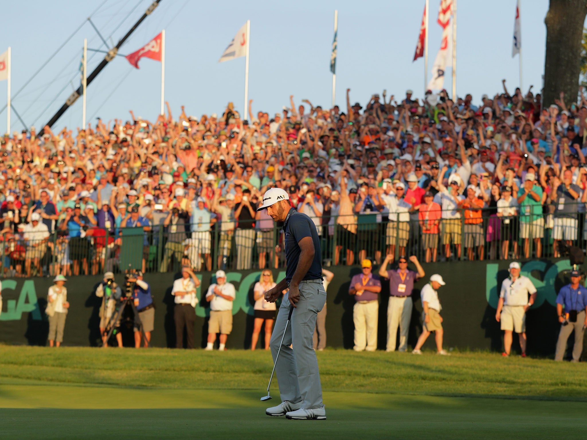 Dustin Johnson rolls in the putt to seal the US Open on Sunday night at Oakmont