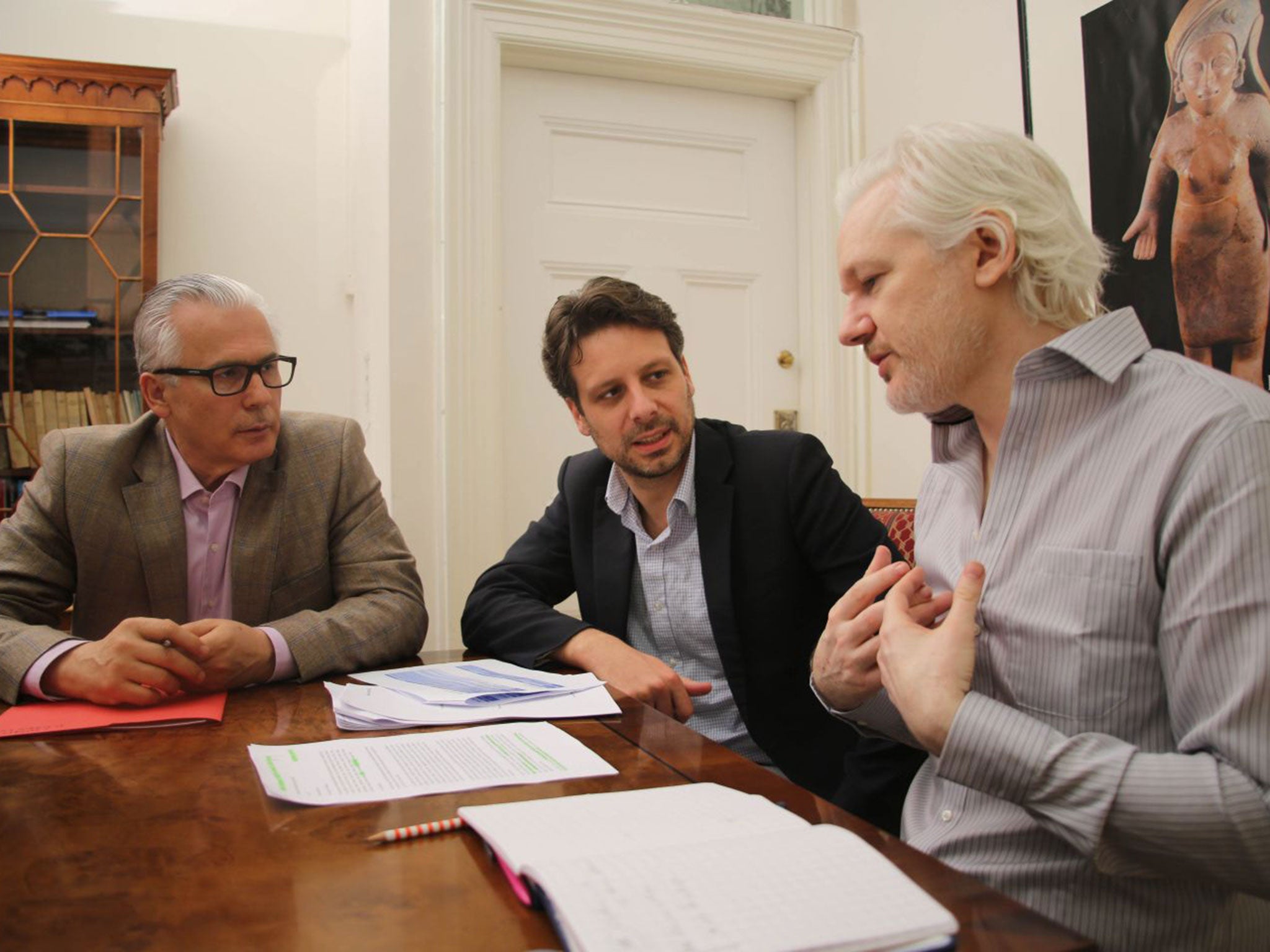 Julian Assange with Ecuador's Foreign Minister Guillaume Long, centre, and Spanish lawyer and former judge Baltasar Garzon at the Ecuadorean embassy