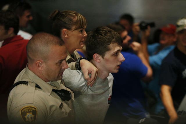 Michael Sandford is removed by police from the Trump rally in Las Vegas in June
