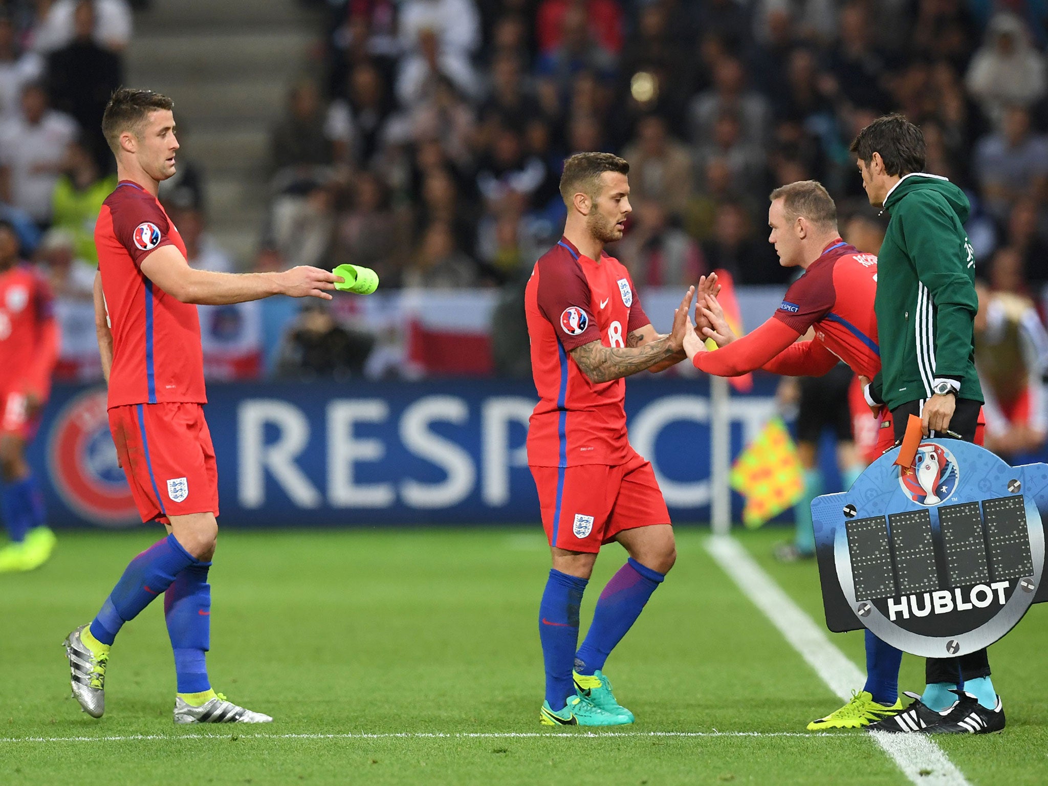 Jack Wilshere is replaced by captain Wayne Rooney during the match against Slovakia