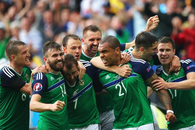 Northern Ireland's players celebrate their victory over Ukraine
