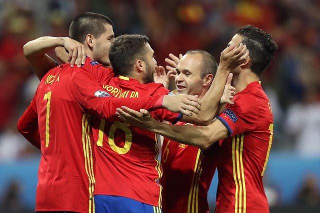 Spain players celebrate their comfortable victory over Turkey