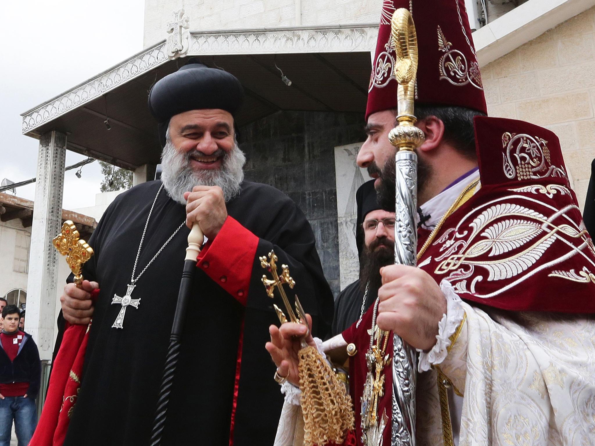 Three bodyguards died in protecting Moran Mor Ignatius Aphrem II, left, the patriarch of the Syriac Orthodox Church