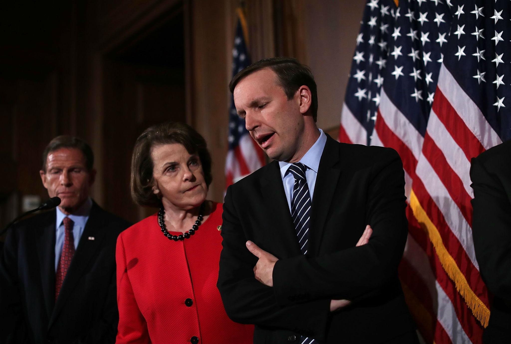 Democratic Senators Dianne Feinstein and Chris Murphy confer at a press conference on 20 June, when their proposals for new gun control measures were rejected by the Republican-held Senate