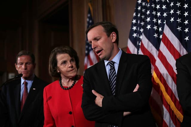 Democratic Senators Dianne Feinstein and Chris Murphy confer at a press conference on 20 June, when their proposals for new gun control measures were rejected by the Republican-held Senate