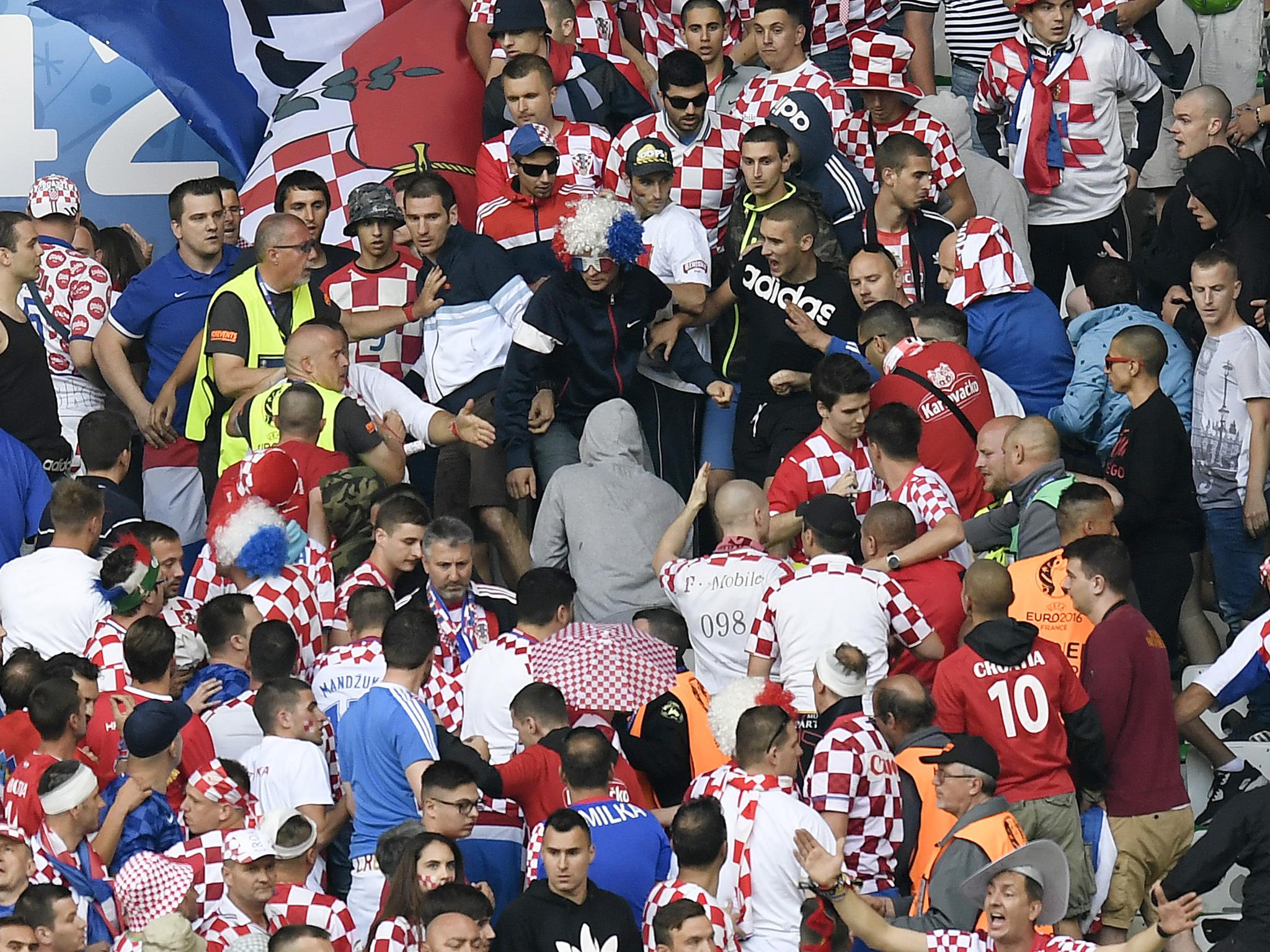 Croatia fans fighting in the stands during the game against the Czech Republic