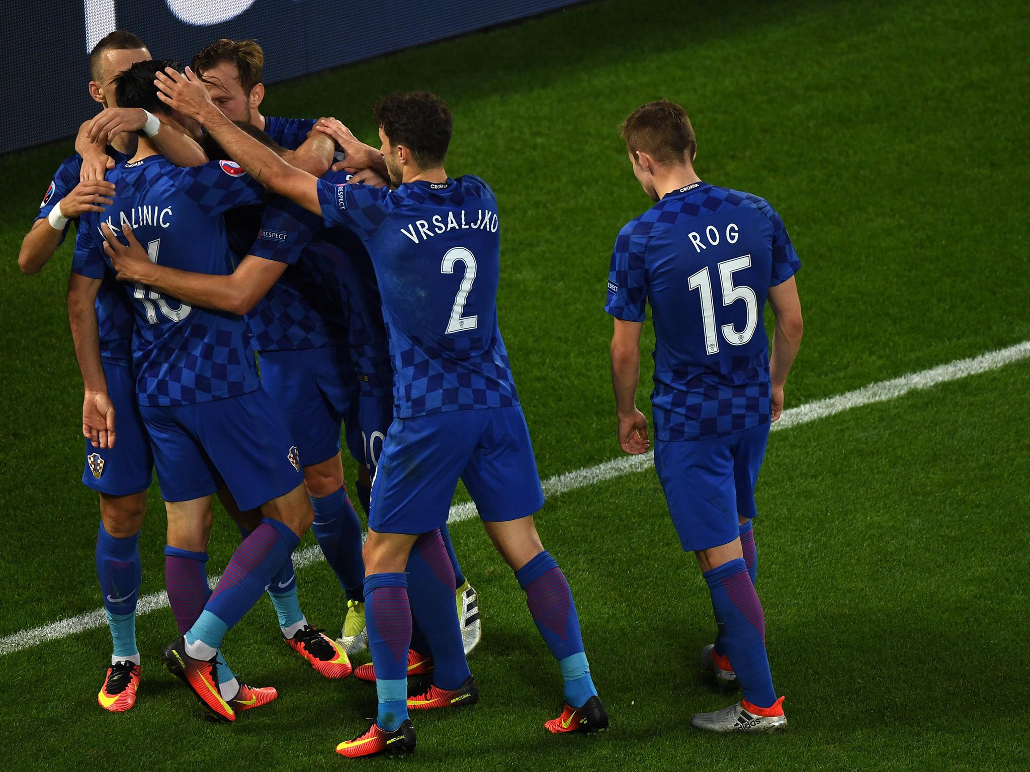 Croatia's players mob Nikola Kalinic after his cute equaliser