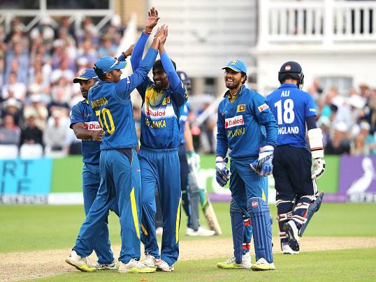 Nuwan Pradeep is congratulated by Sri Lanka colleagues after taking the wicket of Moeen Ali (Getty)