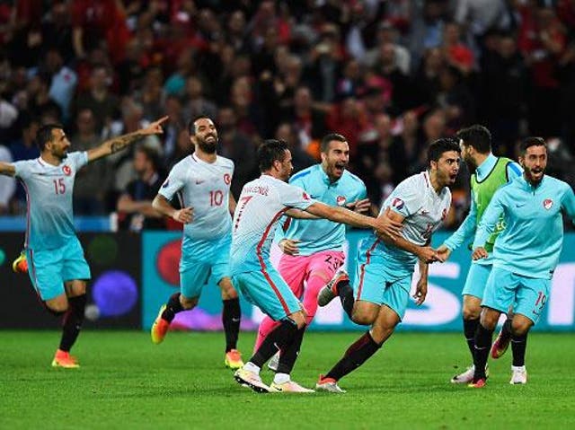Ozan Tufan is congratulated on scoring Turkey's second goal by delighted team-mates (Getty)