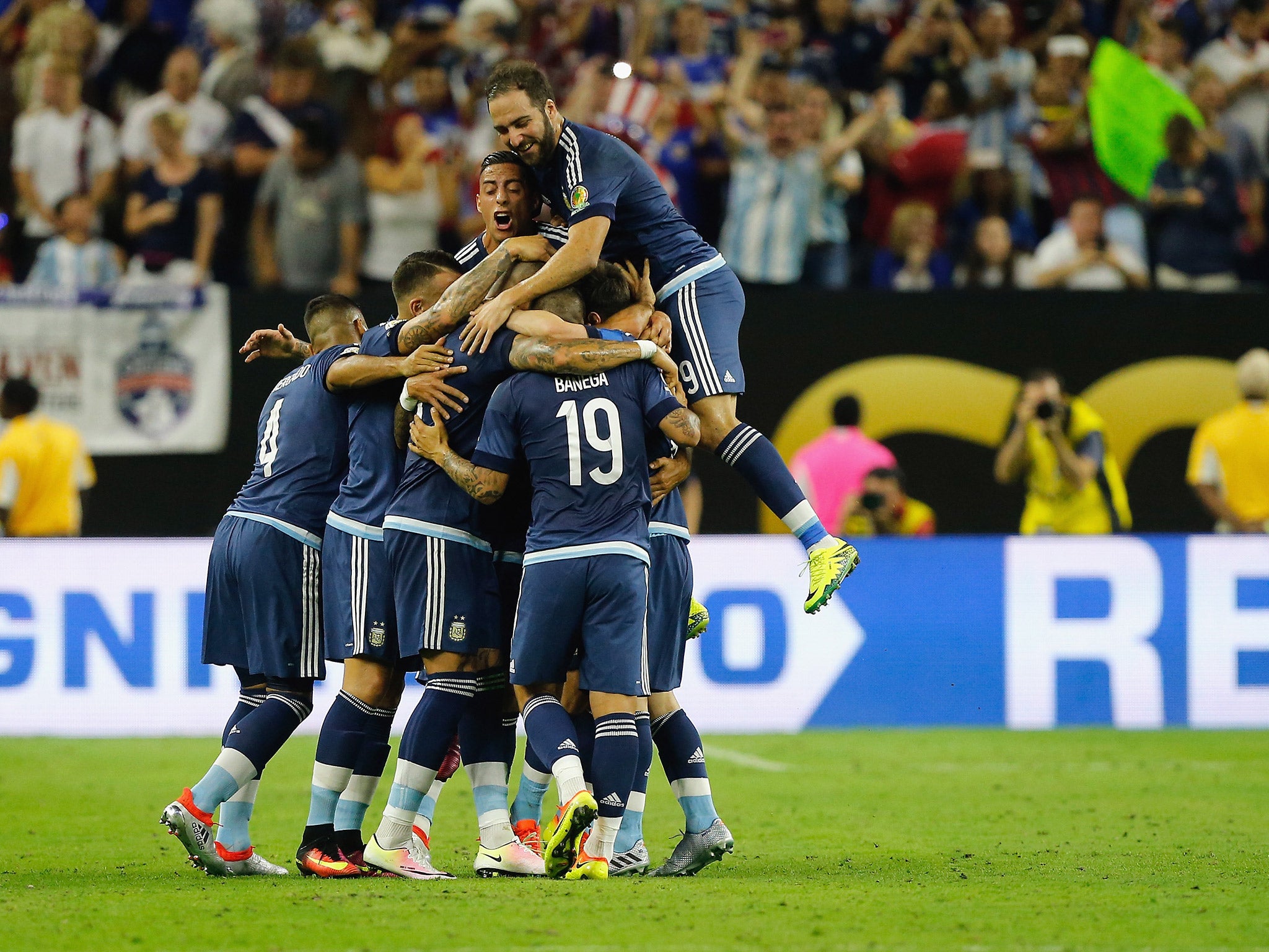 Argentina players celebrate after Lionel Messi scores against the USA