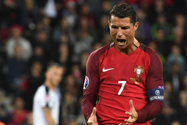 Cristiano Ronaldo reacts after missing a penalty before Portugal against Austria