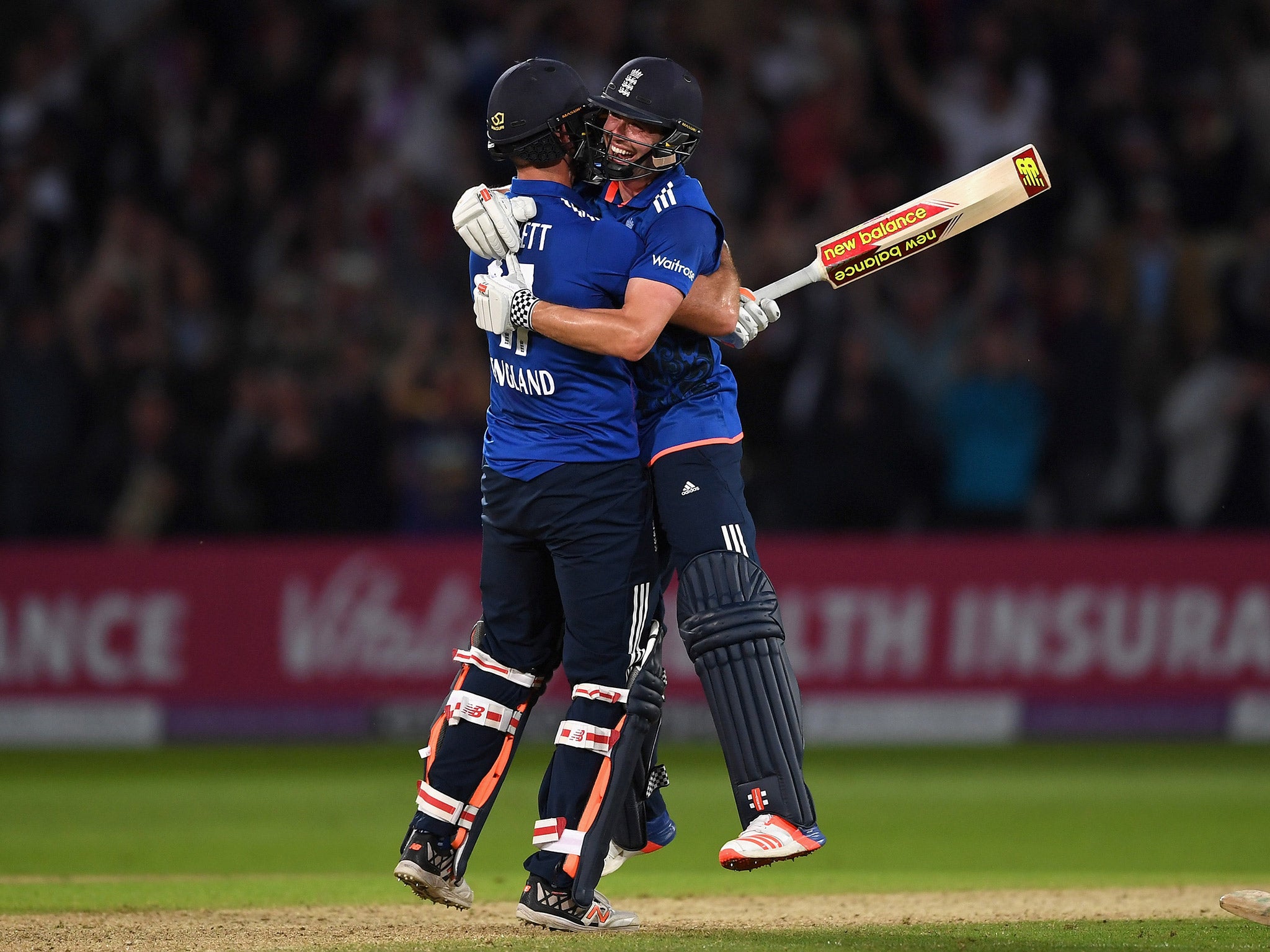 Liam Plunkett and Chris Woakes celebrate after the latter's six secured a tie (Getty)