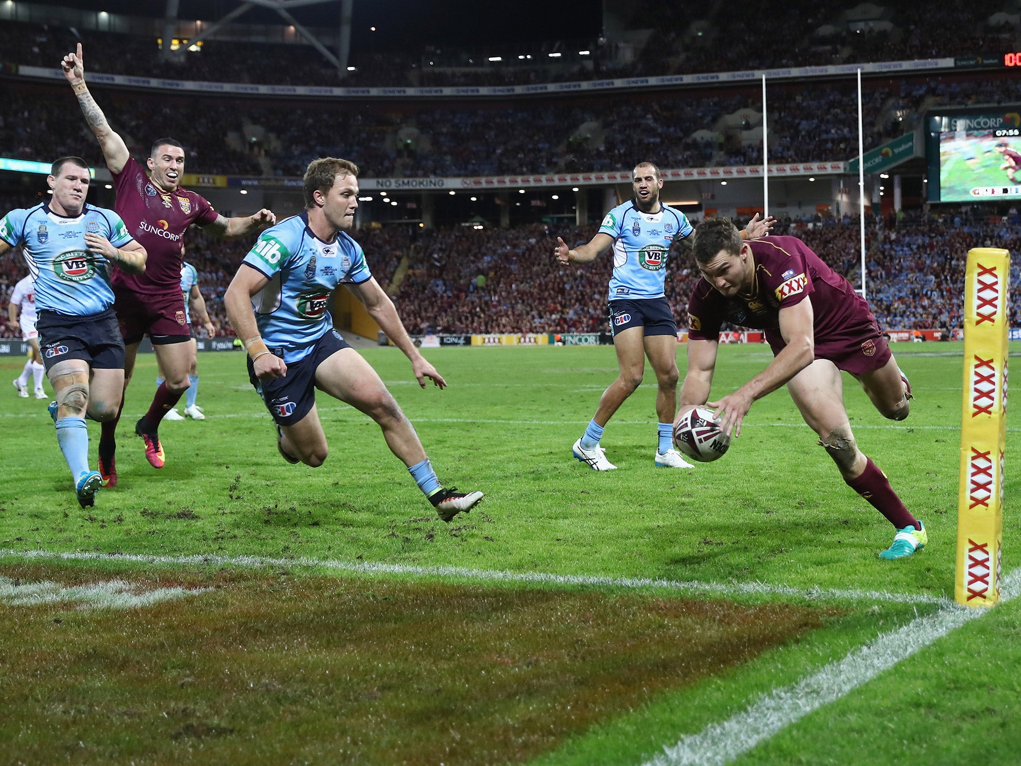 Corey Oates dives over in the corner to score a try for Queensland