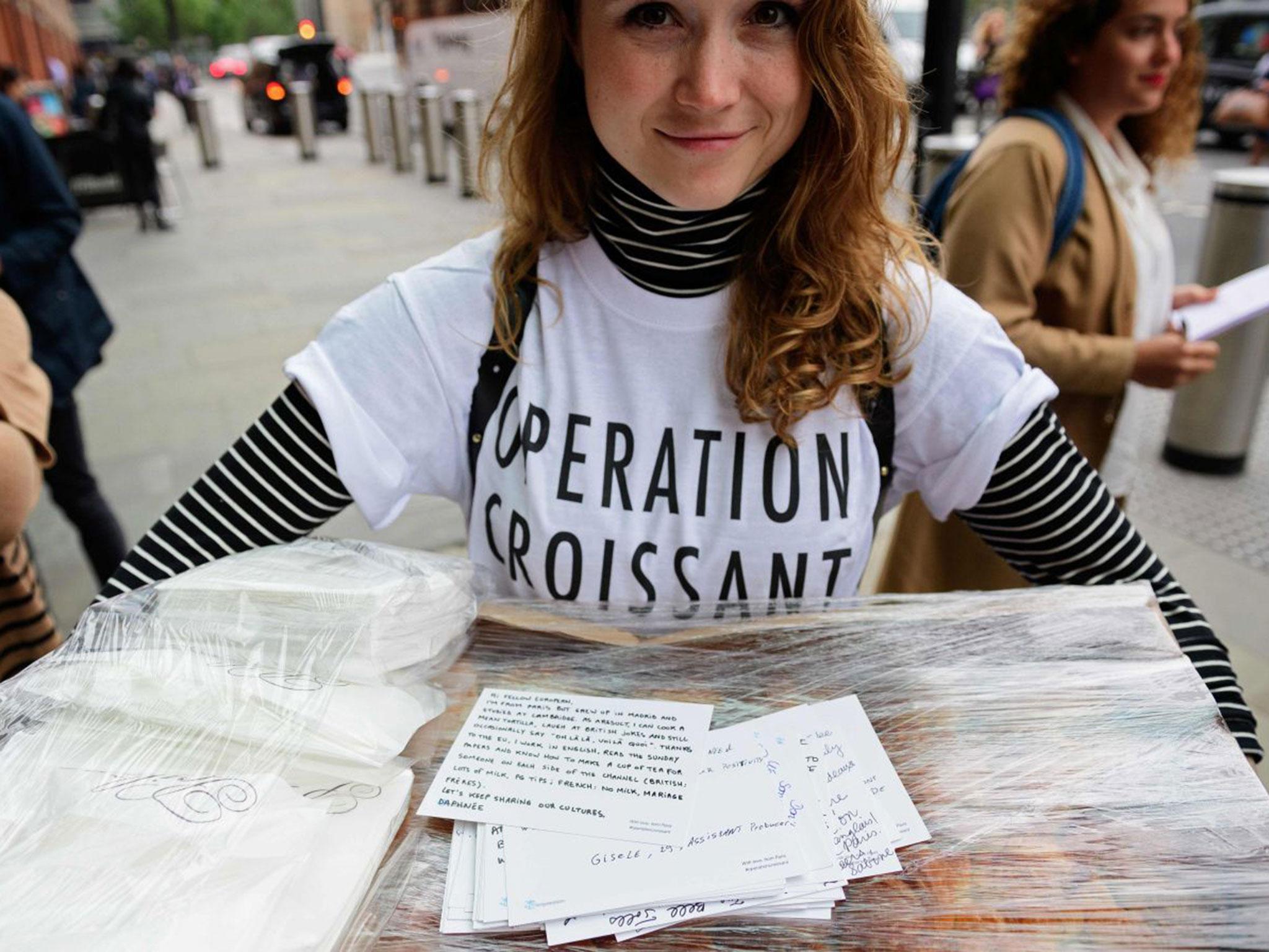 Pro-remain campaigners from 'Operation Croissant', a French pro-EU group, hand out postcards written by Parisians urging people in the UK to vote to remain in the EU