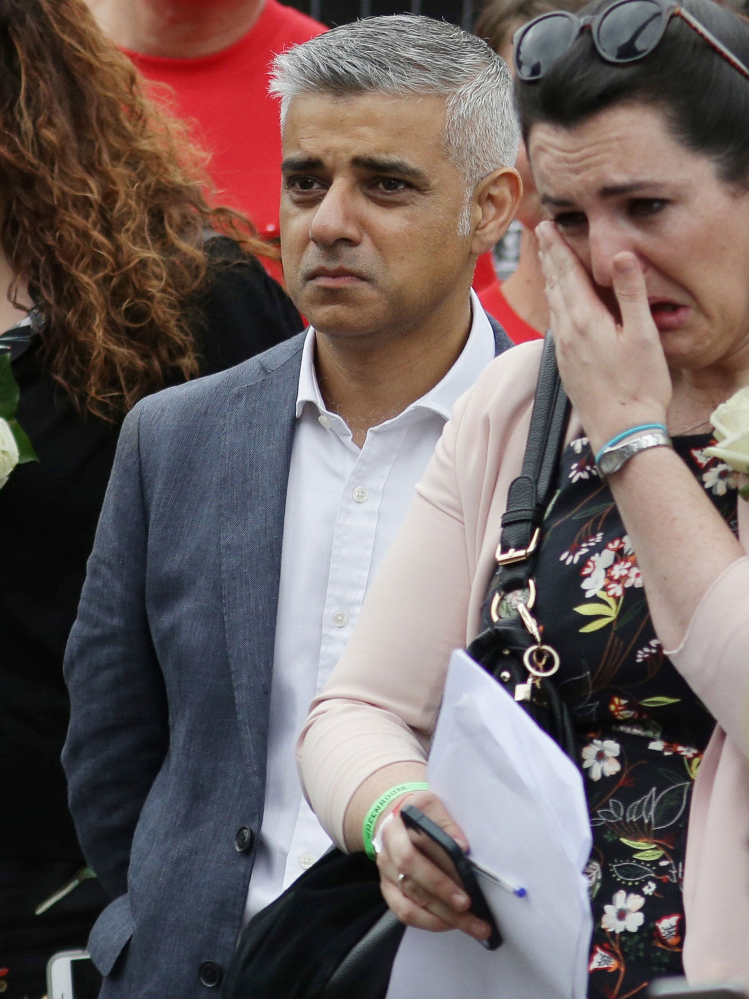 &#13;
Mayor of London Sadiq Khan listens as Brendan Cox addresses the rally in Trafalgar Square &#13;