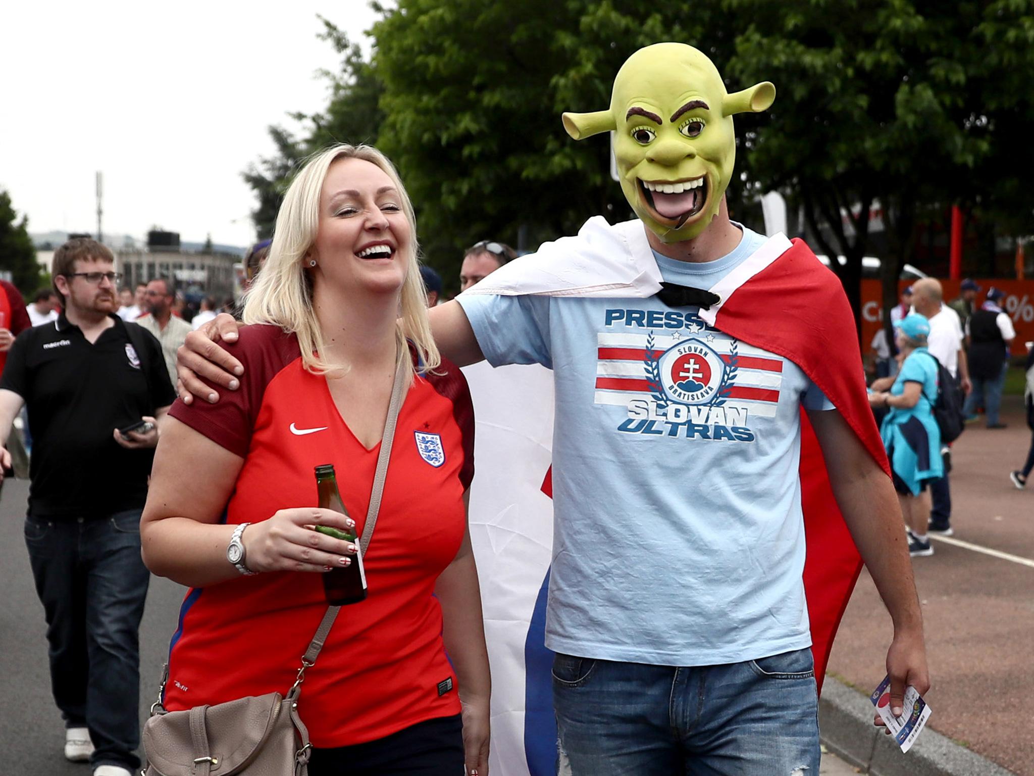 An England and Slovakia fan share a picture in St Etienne