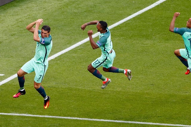 Ronaldo, Nani and Joao Mario celebrate Portugal's third equaliser