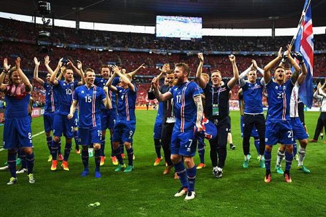 Iceland's players celebrate their qualification at the final whistle in Paris (Getty)