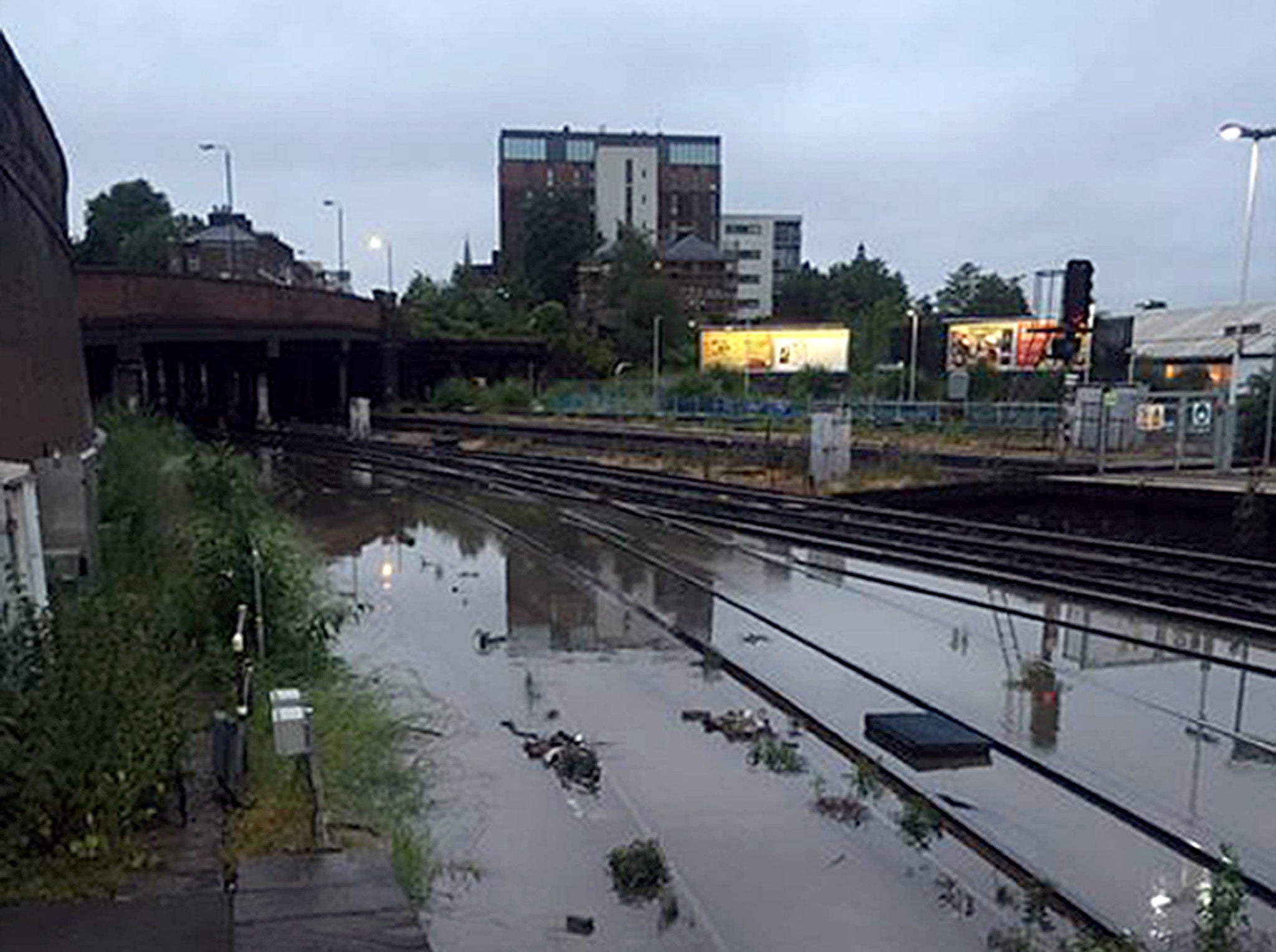 Flooded railway tracks at Clapham Junction, South London