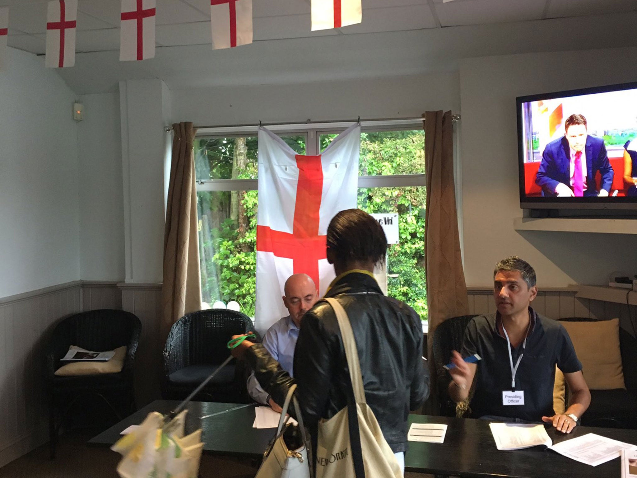 A polling station in Palmers Green, London, was criticised for failing to take down England flags