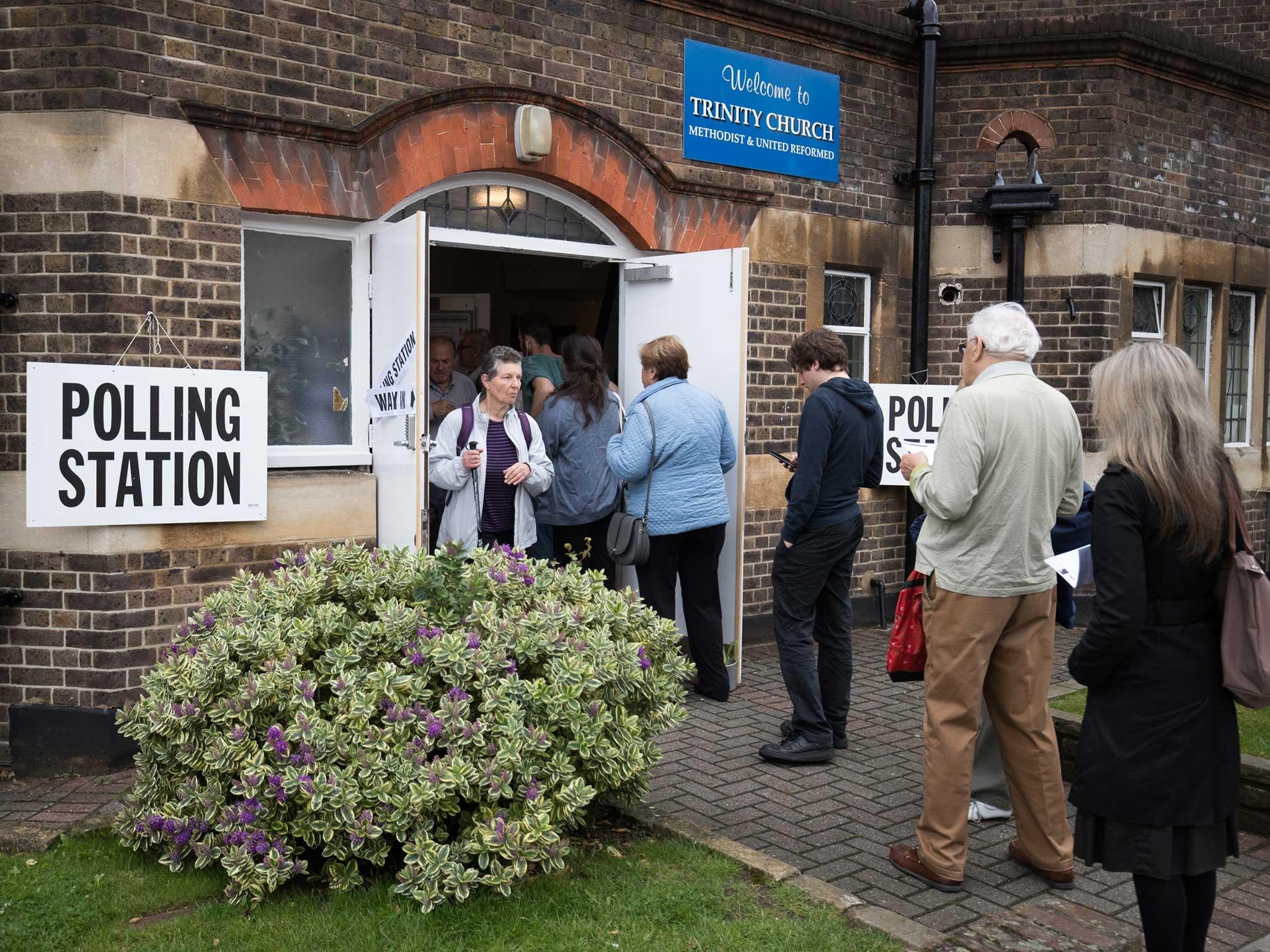 Voters queue up to cast their ballot in the EU referendum