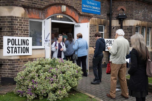 Voters queue up to cast their ballot in the EU referendum