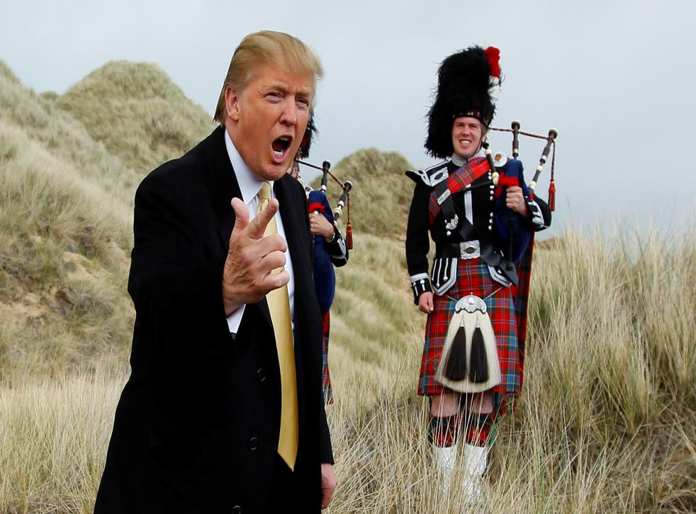 U.S. property mogul Donald Trump gestures during a media event on the sand dunes of the Menie estate, the site for Trump's proposed golf resort, near Aberdeen, Scotland, Britain May 27, 2010