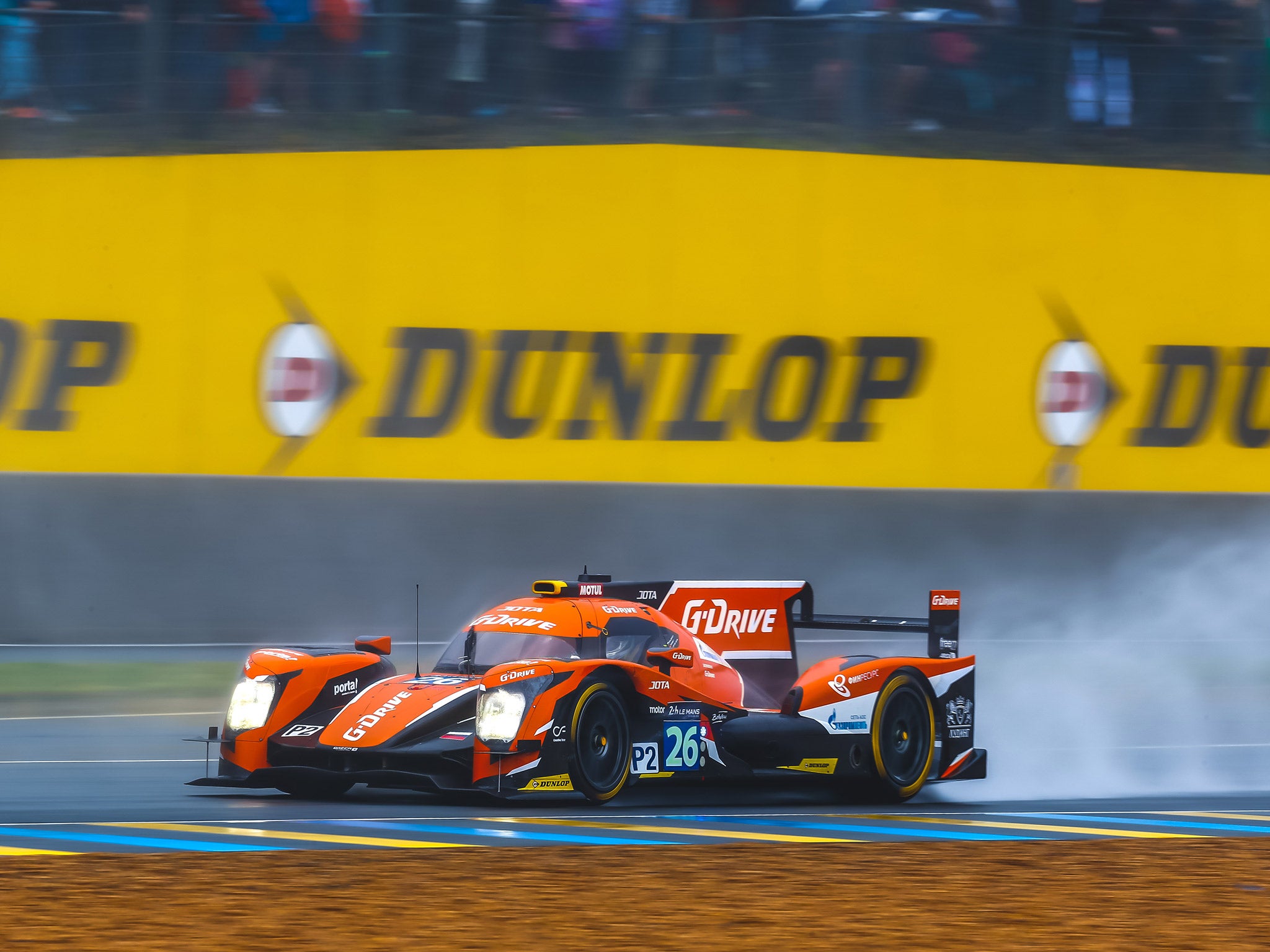 The race began behind the safety car due to torrential rain