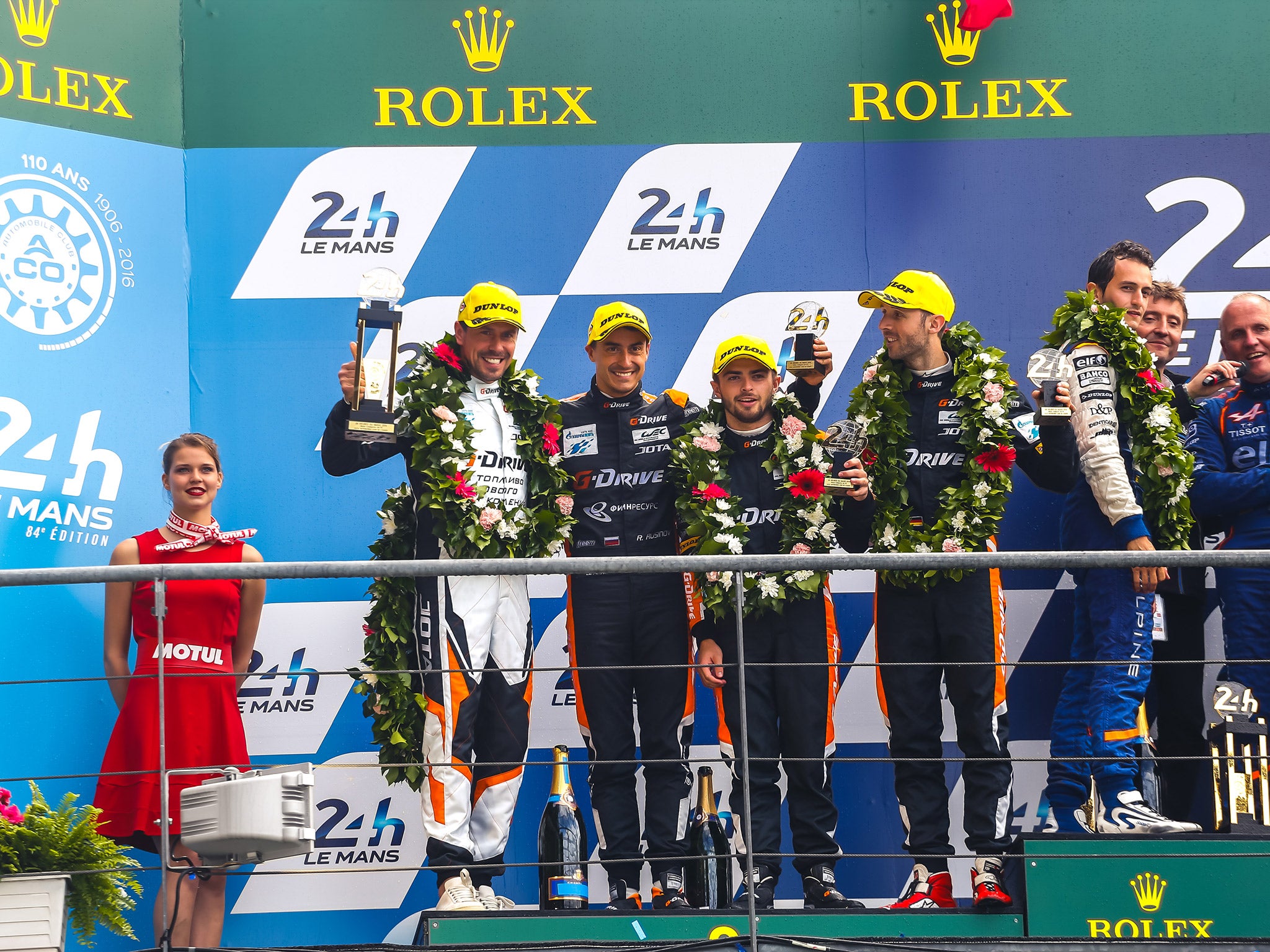 &#13;
Rast, Rusinov and Stevens celebrate on the podium after taking second in LMP2 &#13;