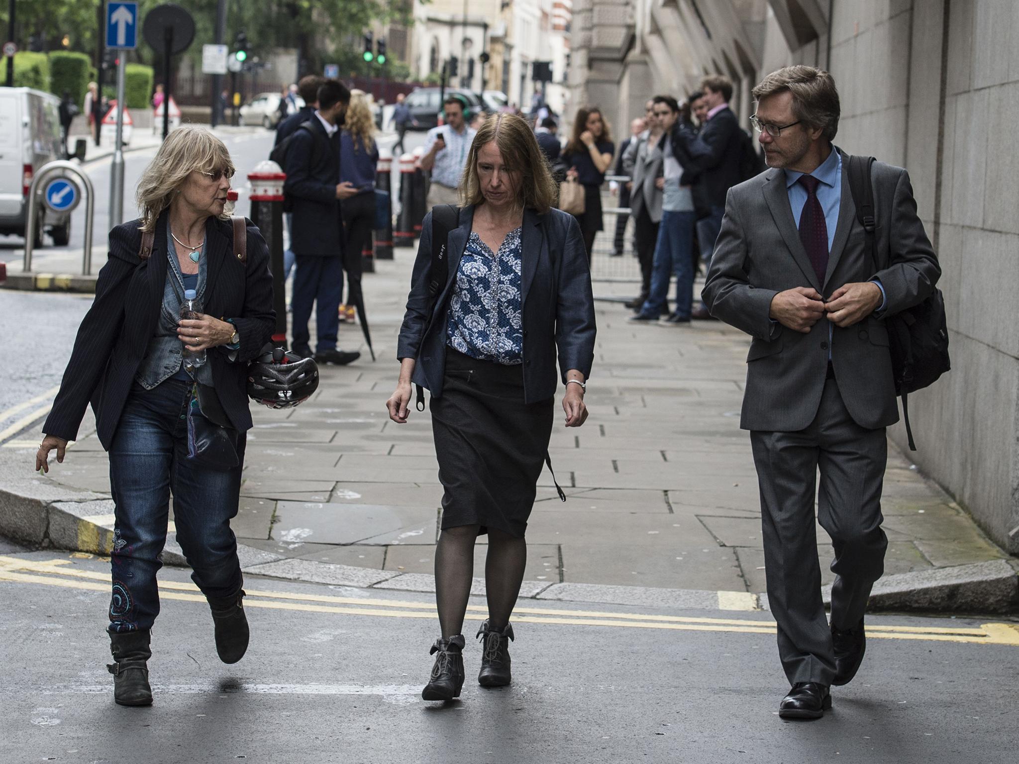 John Letts and Sally Lane arrive at the Old Bailey for a preliminary hearing, where they are accused of sending hundreds of pounds to their 20-year-old