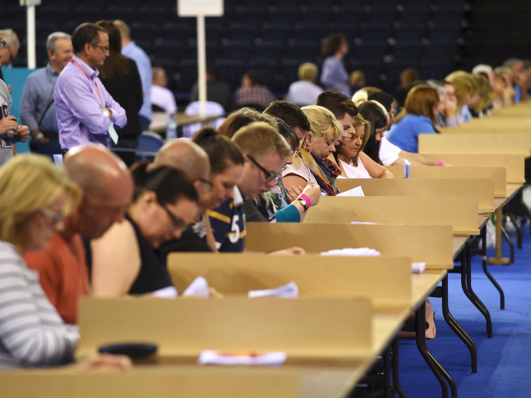 Workers begin counting ballots after polling stations closed in Glasgow