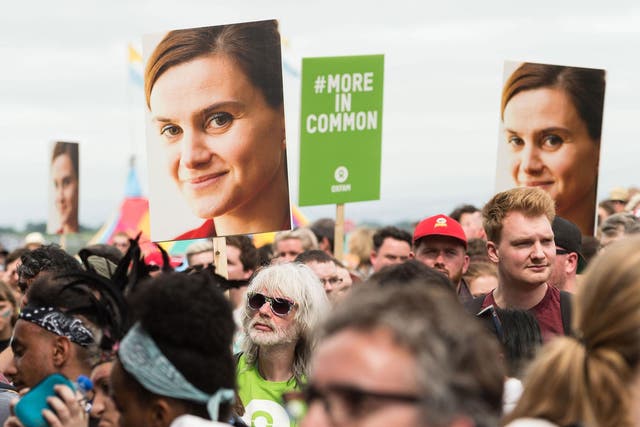Glastonbury Festival goers hold placards to remember murdered MP Jo Cox