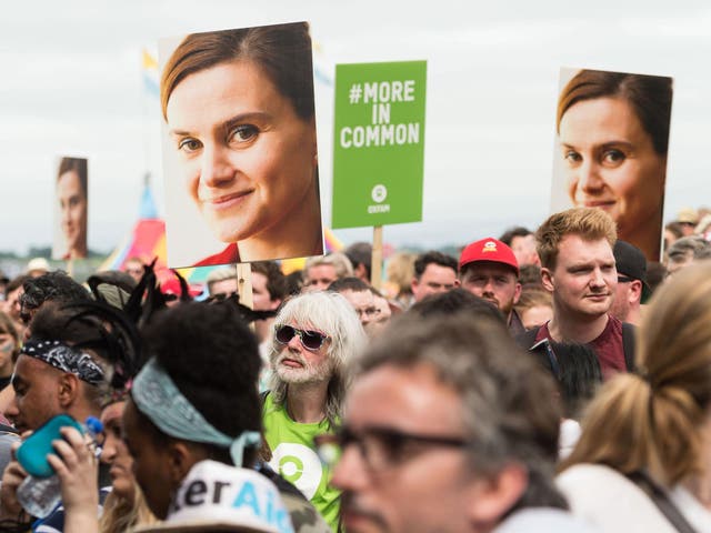 Glastonbury Festival goers hold placards to remember murdered MP Jo Cox