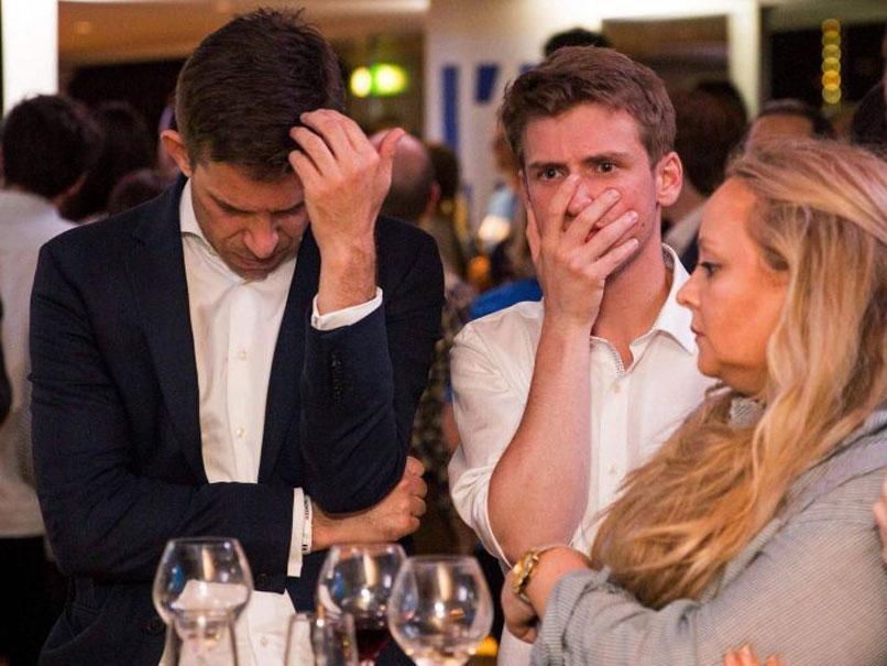 Remain Campaign supporters contemplate Brexit as the EU Referendum results come in