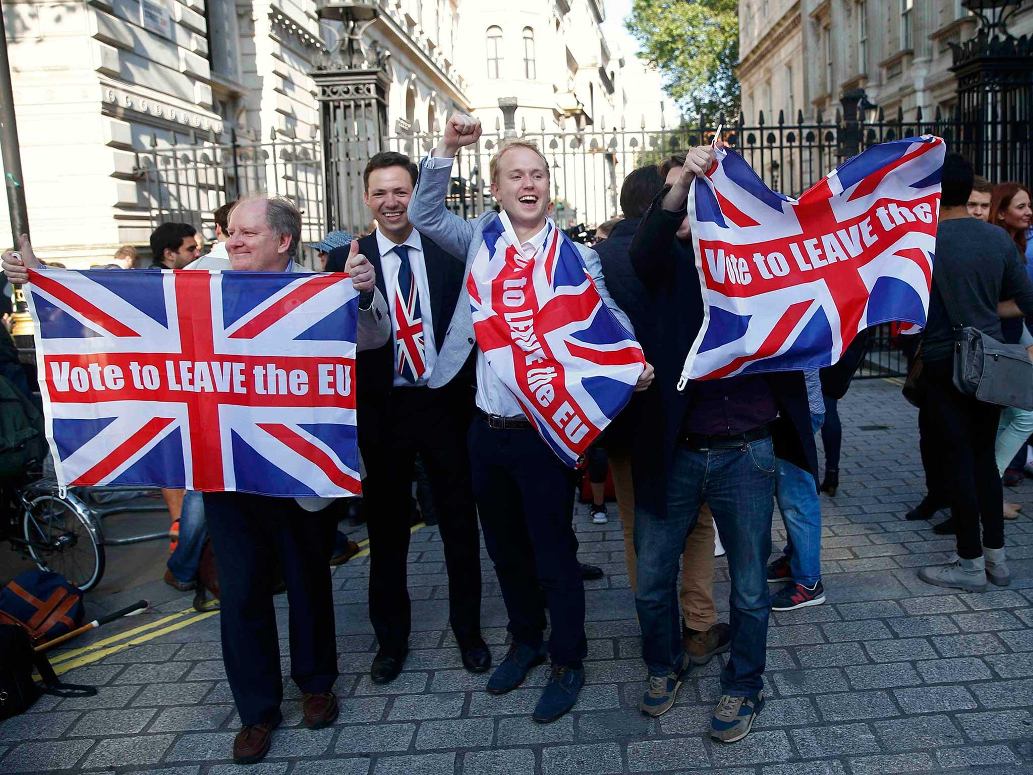 Vote leave supporters wave Union flags, following the result of the EU referendum, outside Downing Street in London