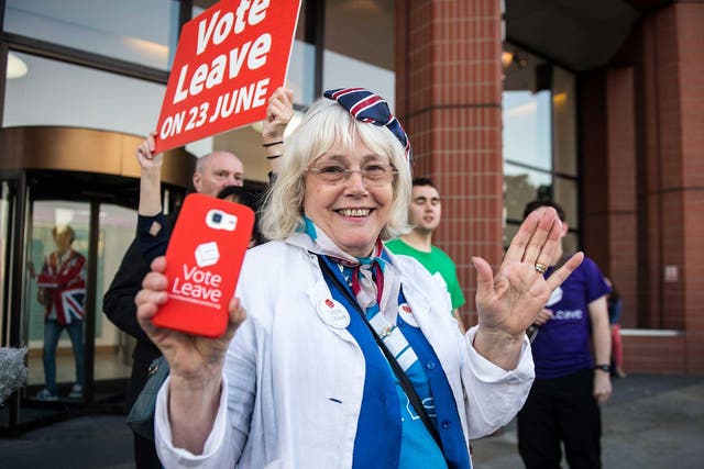 A vote LEAVE supporter Christine Forrester celebrates with others outside Vote Leave HQ, Westminster Tower in London