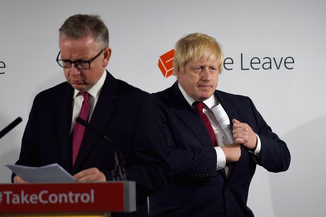 Boris Johnson (right) pockets his notes as fellow Vote Leave campaigner Michael Gove prepares to speak