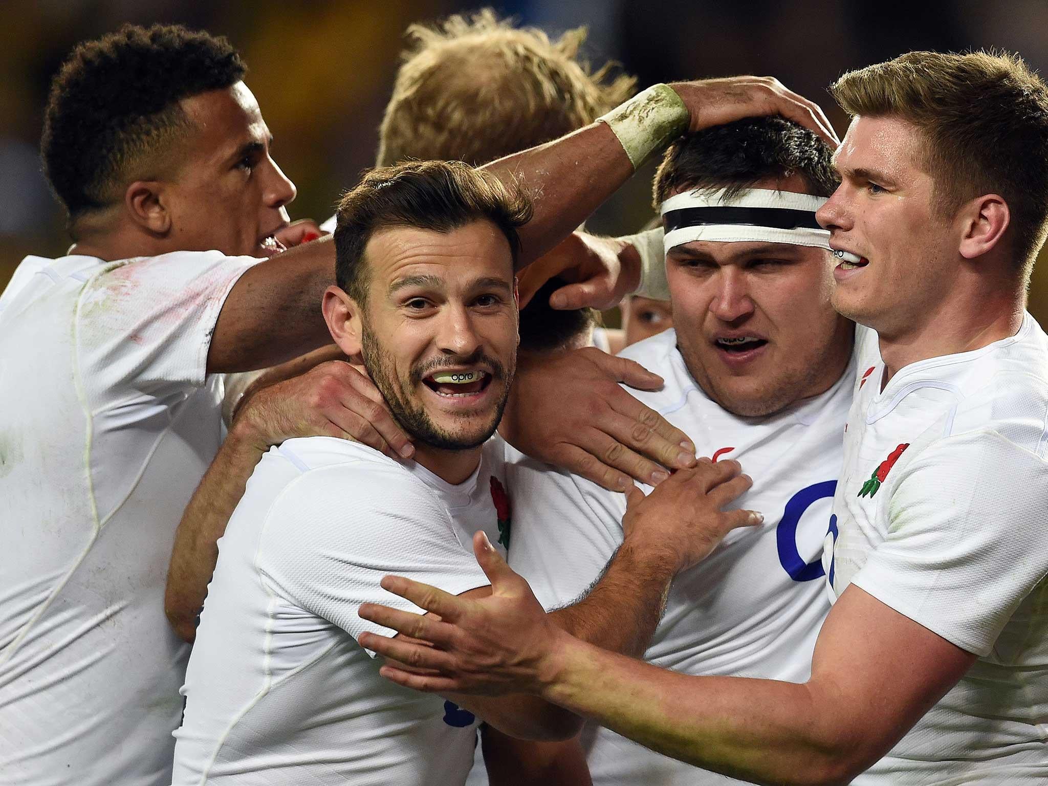 Jamie George is mobbed by his England team-mates