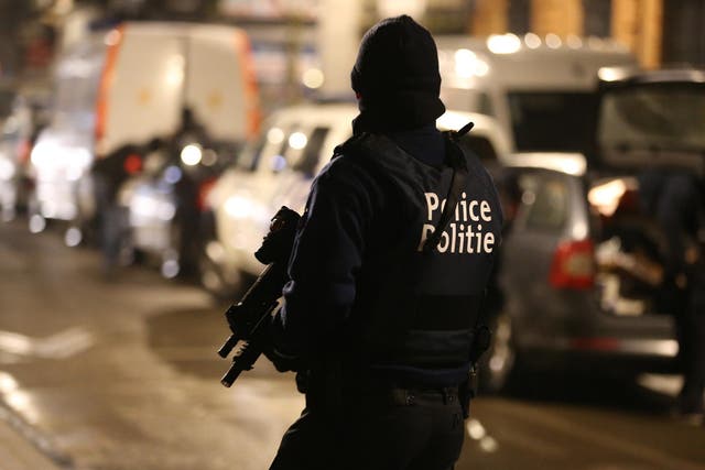 Police officers take part in an operation in Schaerbeek - Schaarbeek, Brussels, late on March 24, 2016