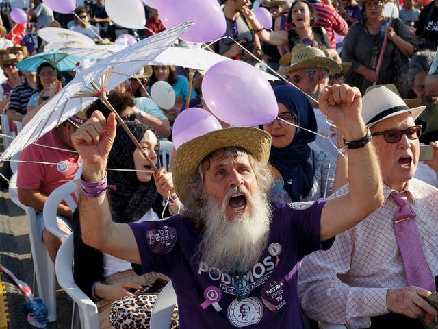 Supporters of left wing alliance party Unidos Podemos 'United We Can' cheer during the final rally ahead of Spanish General Elections on June 24, 2016 in Madrid