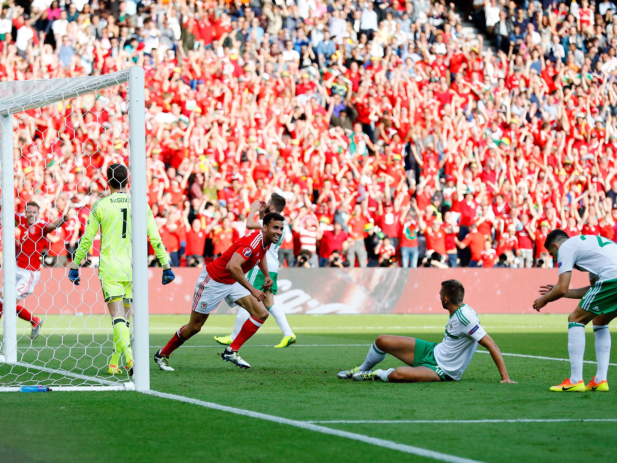 Gareth McAuley deflects the ball into his own net in Northern Ireland's defeat by Wales