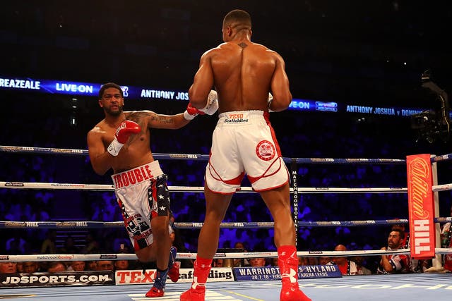 Dominic Breazeale stumbles after a big right hand from Anthony Joshua