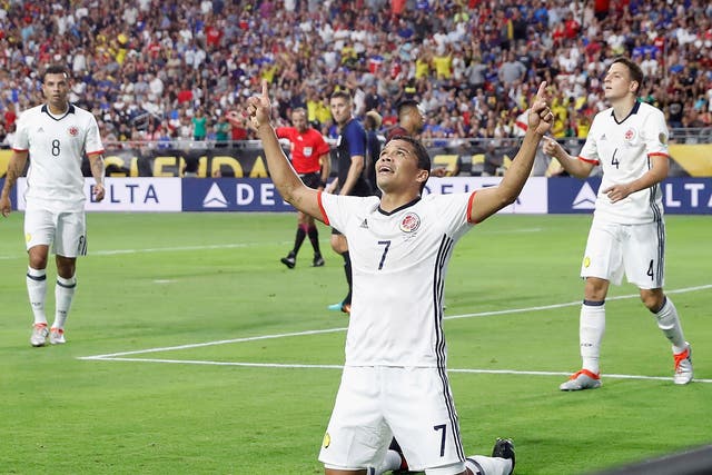 Carlos Bacca celebrates scoring the winning goal for Colombia