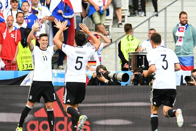Julian Draxler celebrates with Mats Hummels after scoring for Germany against Slovakia