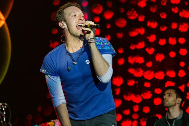 Coldplay perform on the Pyramid Stage on Sunday night of Glastonbury Festival