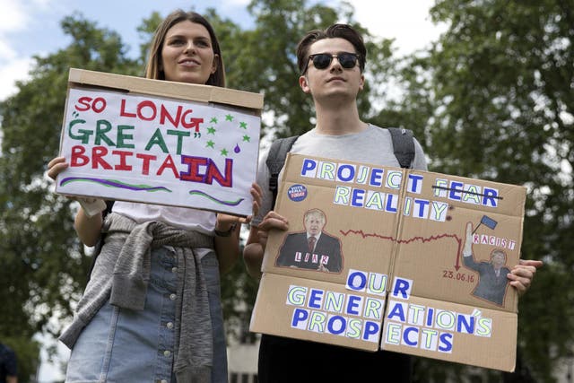 Young demonstrators hold placards during a protest against the Brexit result in central London