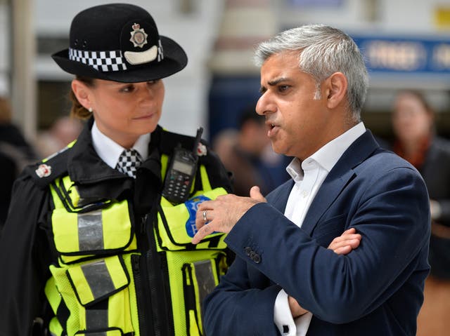 London Mayor Sadiq Khan speaking to a British Transport Police Superintendent Gill Murray