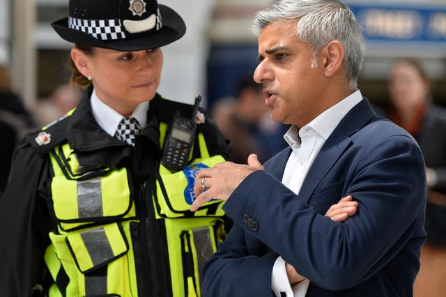 London Mayor Sadiq Khan speaking to a British Transport Police Superintendent Gill Murray