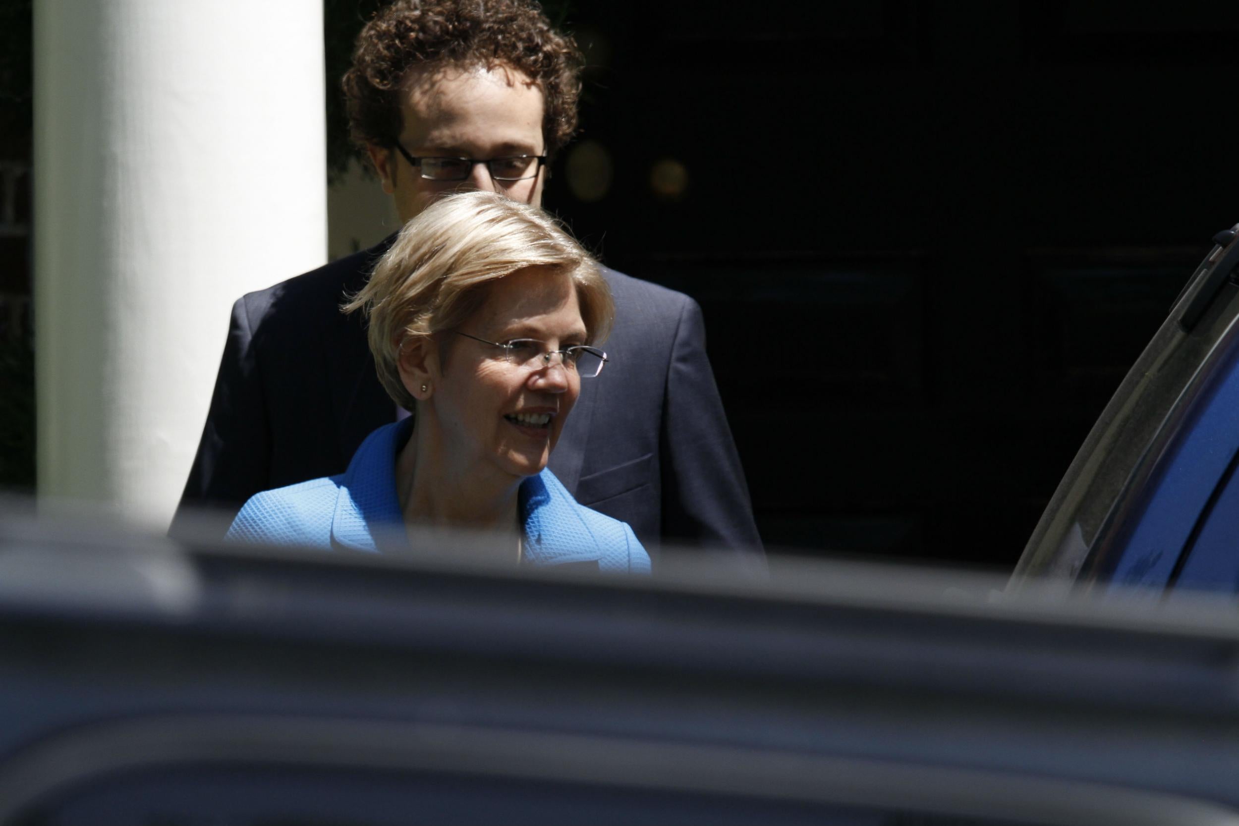 Elizabeth Warren emerges recently from a meeting with Hillary Clinton
